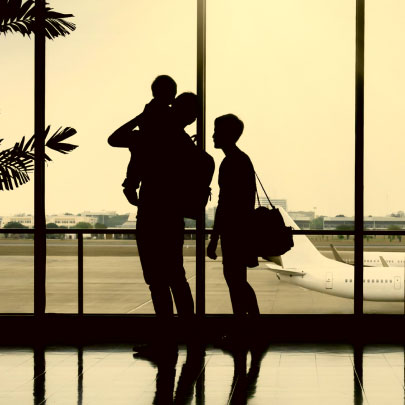 wealth-builders small family at an airport