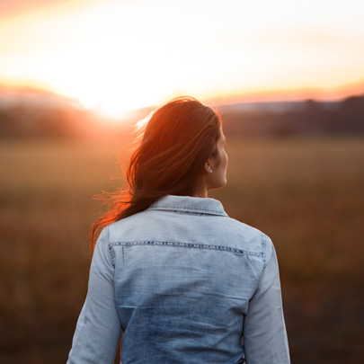 Next-Chapter-Women woman standing in a field