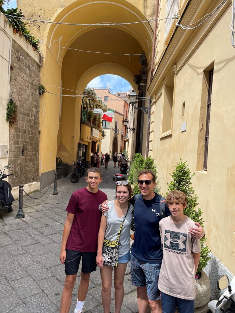 family on street in italy
