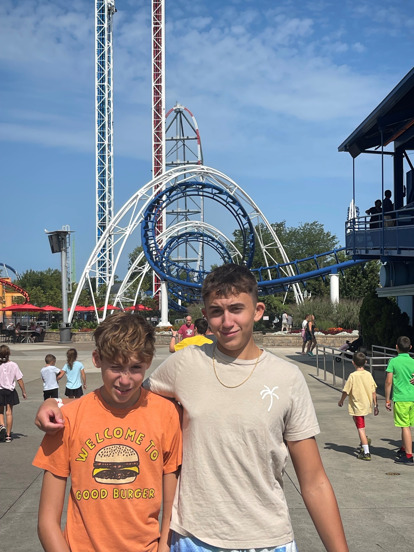 Two boys hanging out at the amusement park
